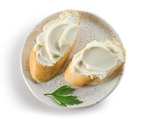 Image showing baguette slices with cream cheese 