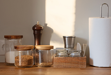 Image showing various containers on kitchen table