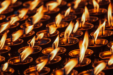 Image showing Burning candles in Buddhist temple