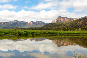 Image showing Steep cliffs of the Capertee canyon reflecting in water