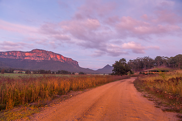 Image showing Morning sunlight htting the top of the ridges and their sheer cl