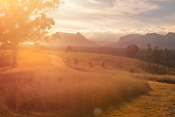 Image showing Sunlight bursting through the valley across the landscape