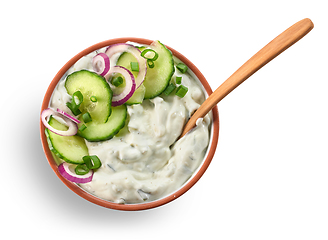 Image showing bowl of greek yogurt with cucumber and red onion