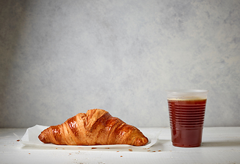 Image showing freshly baked croissant and coffee