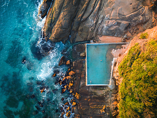 Image showing Early morning golden light on the rocks and tidal pool Whale Bea