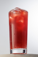 Image showing glass of red iced drink