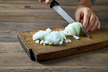 Image showing the cook cuts the onion