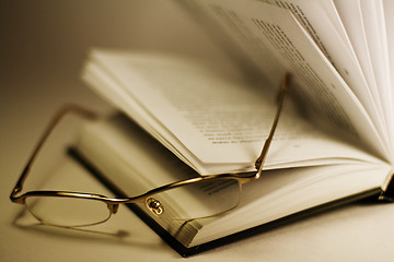 Image showing opened book and glasses