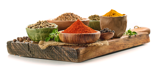 Image showing various spices on wooden board