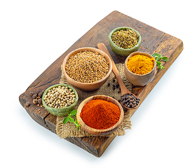 Image showing various spices on wooden board