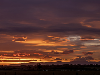 Image showing Sunrise and Lenticular Clouds