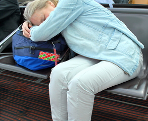 Image showing Female sleeping in airport.