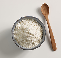 Image showing bowl of flour and wooden spoon