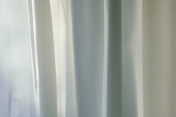 Image showing curtains hang in front of window