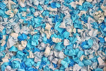 Image showing blue and white damaged papers