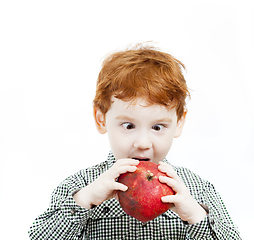 Image showing boy eats pomegranate