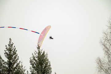 Image showing Paraglider is flying in the sky