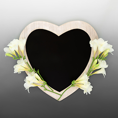Image showing Heart Shape Chalkboard Frame with Freesia Flowers