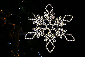 Image showing Beautiful christmas decoration, bright glowing neon snowflake