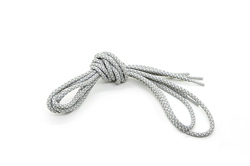 Image showing New shoelaces tied in a knot isolated on white background