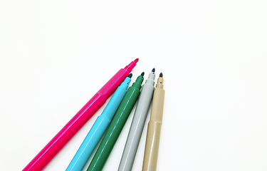 Image showing Bright multicolored markers isolated on a white background 