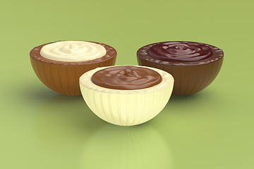 Image showing Different chocolate candies on green background