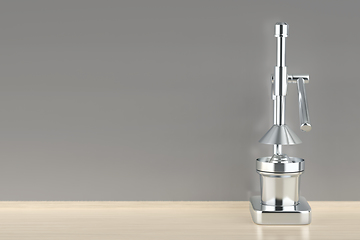 Image showing Silver citrus juicer in the kitchen
