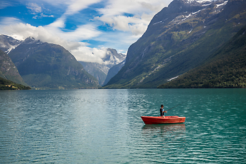 Image showing Woman fishing on a boat.