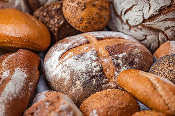 Image showing Freshly baked natural bread is on the kitchen table.