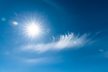 Image showing Clouds in the blue sky. Bright midday sun illuminates the space.