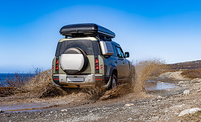 Image showing Off road tourist car rides off-road in the highlands. Expedition