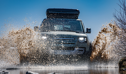 Image showing Off road tourist car rides off-road in the highlands. Expedition