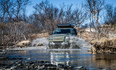 Image showing Off road tourist car rides off-road in the highlands. Expedition