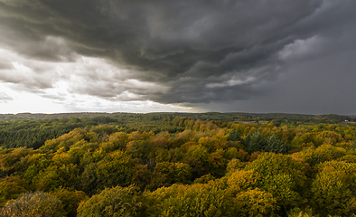 Image showing Dark storm clouds over the autumn forest