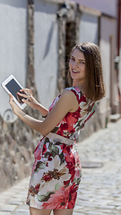 Image showing Young Woman Using a Tablet