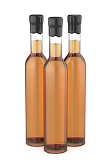 Image showing Three glass bottles with whisky