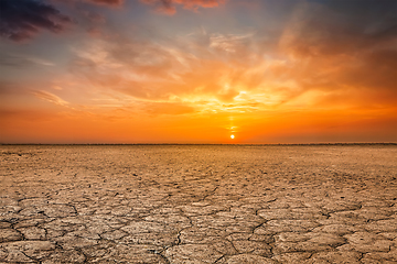 Image showing Cracked earth soil sunset landscape