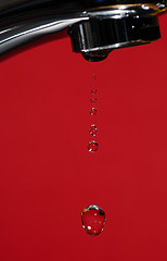 Image showing A water tap is dripping