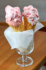 Image showing ice cream in cones on restaurant table