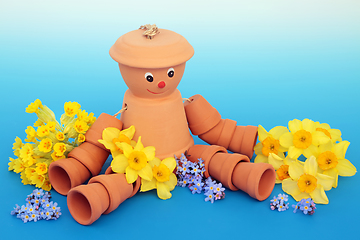 Image showing Recycled Fun Flower Pot Man Garden Ornament and Spring Flowers