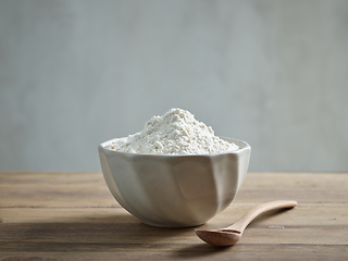 Image showing bowl of flour on wooden kitchen table