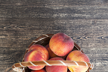 Image showing basket of ripe peaches