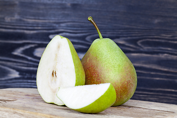 Image showing several green pears