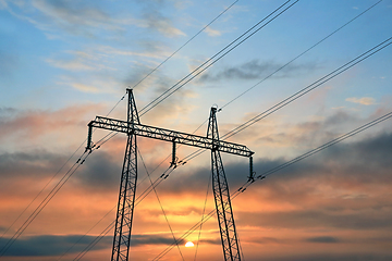 Image showing Electricity Pylon Against Sunrise Sky