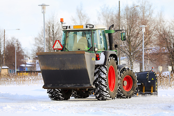 Image showing Tractor Spreading Grit and Ploughing Snow