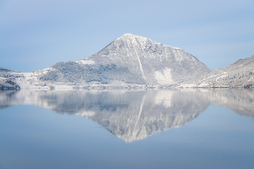 Image showing reflection of snowcovered mountain by the ocean