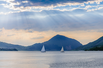 Image showing sailboats on calm sea and clouds