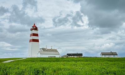 Image showing lighthouse on the coast with clouds