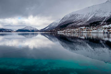 Image showing calm ocean with reflection of mountains