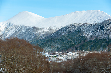 Image showing snowy mountains above small town